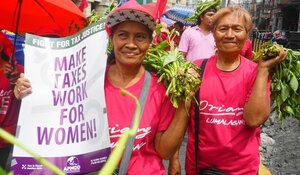 Women protesting for tax justice.