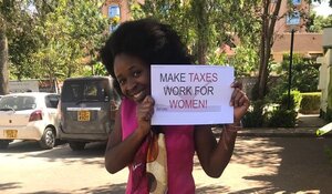 Woman protesting for tax justice in Kenya.